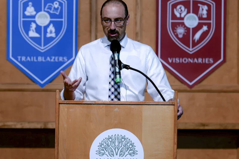 Brett Potash, Head of School, greeting a student
