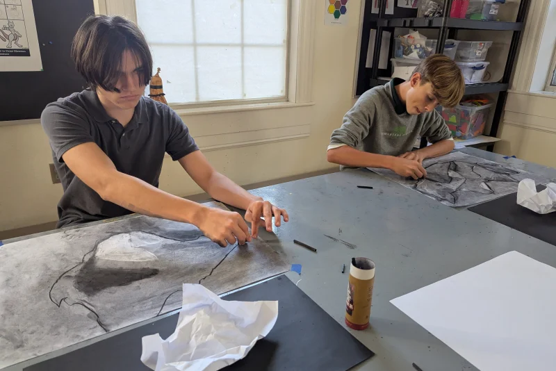 Students working on an art project together