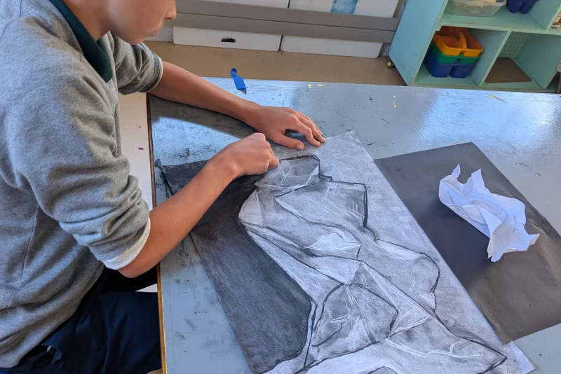 A student painting in art class
