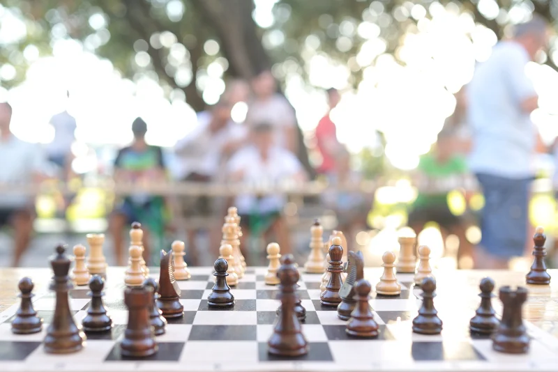 Students playing chess together