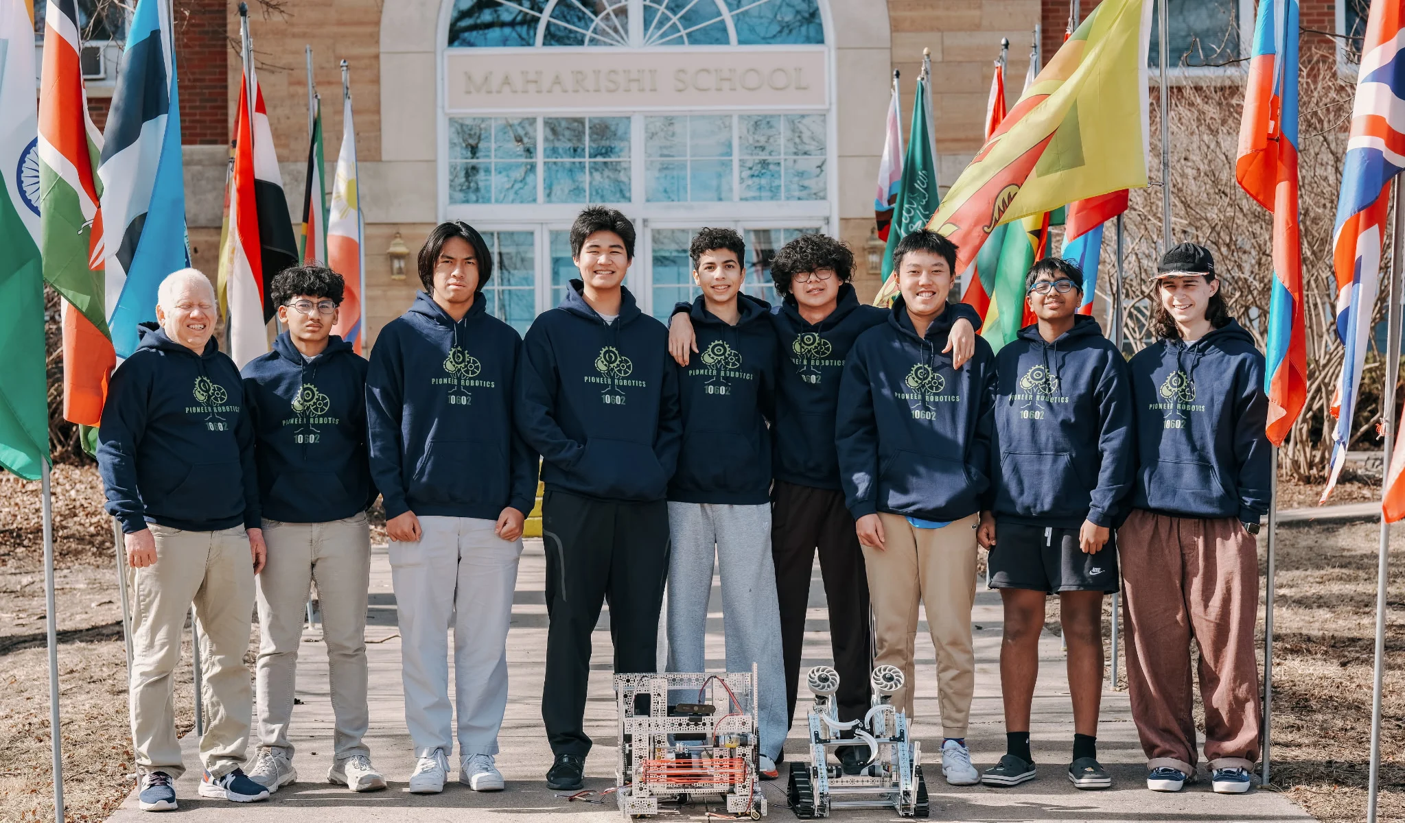 The Maharishi School robotics team with their robots