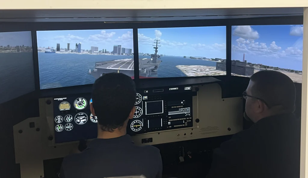A high school student in the aviation flight simulator