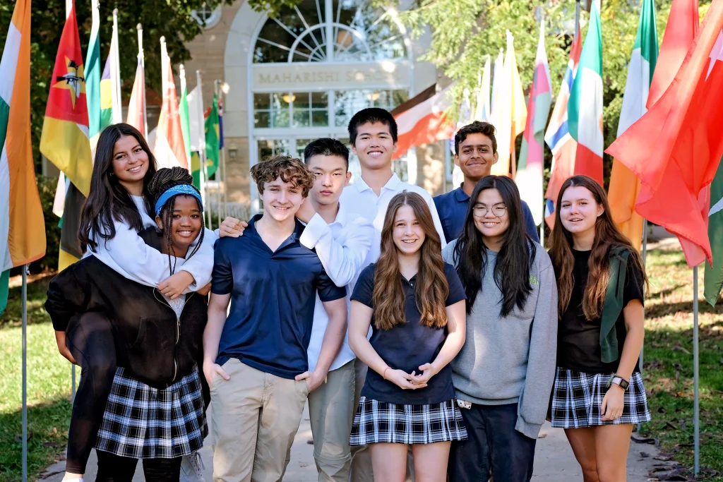 High school students on the front steps of campus