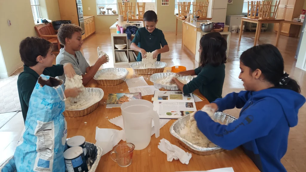 Middle school students cooking together