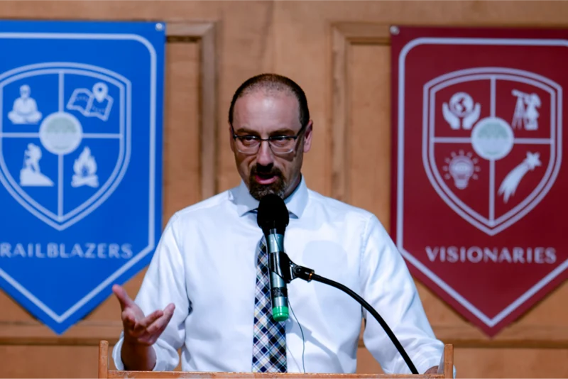 Brett Potash, Head of School, greeting a student