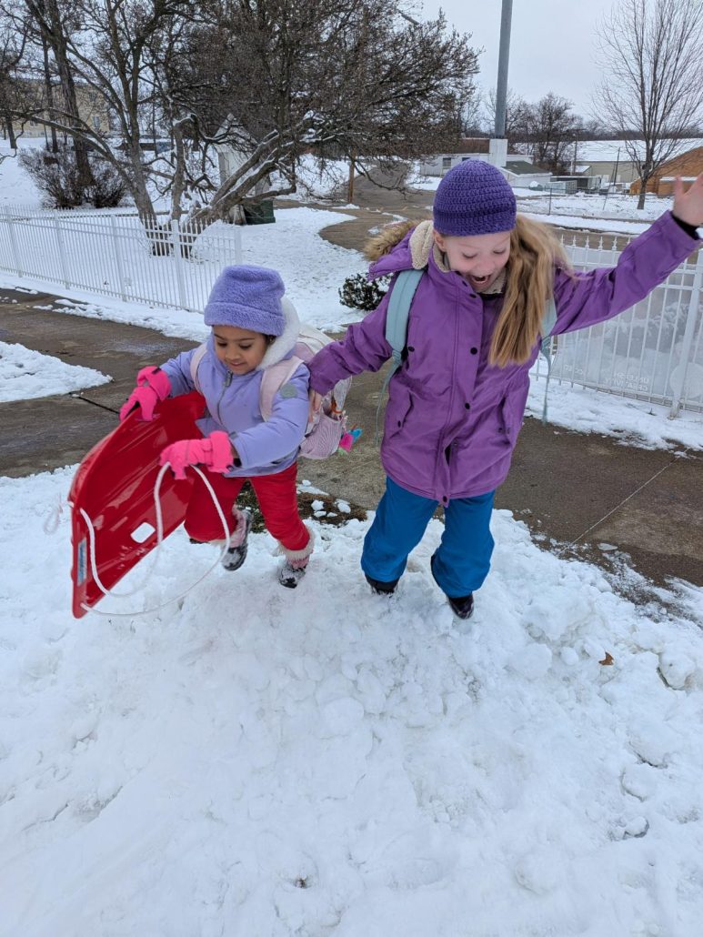 kids in snow pile